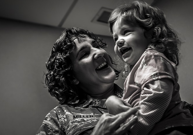 Maj. Tami Miller, Family Nurse Practitioner flight commander, patiently waits for the doctor with her two-year-old daughter Olivia during a routine checkup at the Pediatrics  clinic at Joint Base Charleston – Air Base, S.C. Feb. 1, 2013.  The 628th Medical Group pediatricians support Airmen by supporting their families every day. Their mission is to guide, support and assist families through the physical, mental and emotional growth of children, as well as treating illness. (U.S. Air Force photo / Airman 1st Class Tom Brading)  