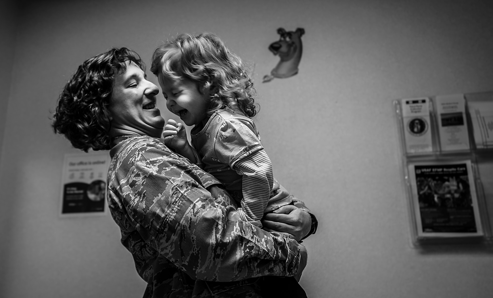 Maj. Tami Miller, Family Nurse Practitioner flight commander, plays with her two-year-old daughter, Olivia, Feb. 1, 2013, at the 628th Medical Group Pediatrics clinic   at Joint Base Charleston – Air Base, S.C. The 628th MDG pediatricians   support Airmen by guiding and assisting families through the physical, mental and emotional growth of children, as well as treating illness. (U.S. Air Force photo / Airman 1st Class Tom Brading)  