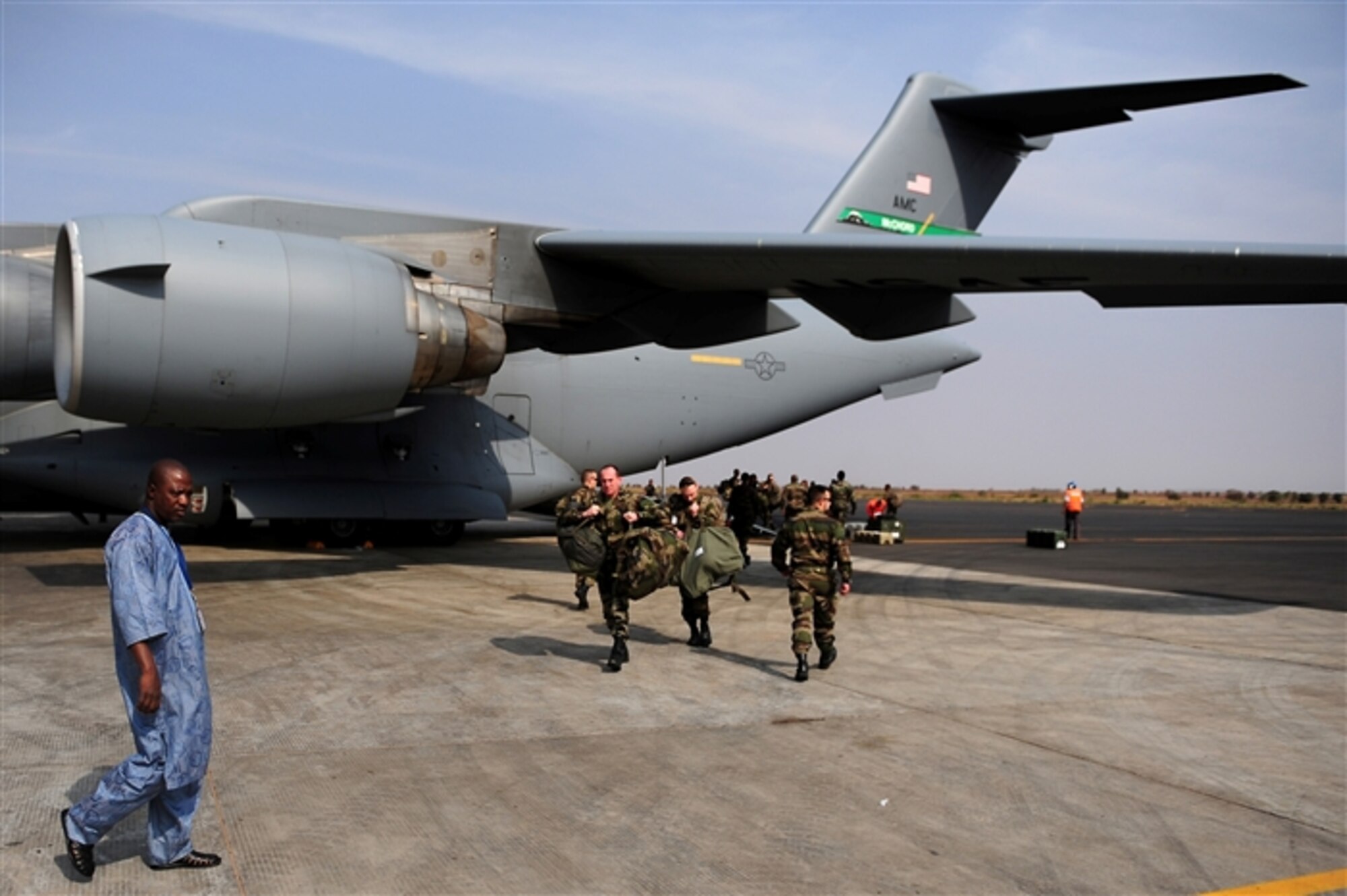 BAMAKO, Mali -- French soldiers leave a U.S. Air Force C-17 Globemaster III in Bamako, Mali, Jan. 23, 2013. The C-17 is assigned to Joint Base Lewis-McChord, Wash. (U.S. Air Force photo by Senior Airman James Richardson)