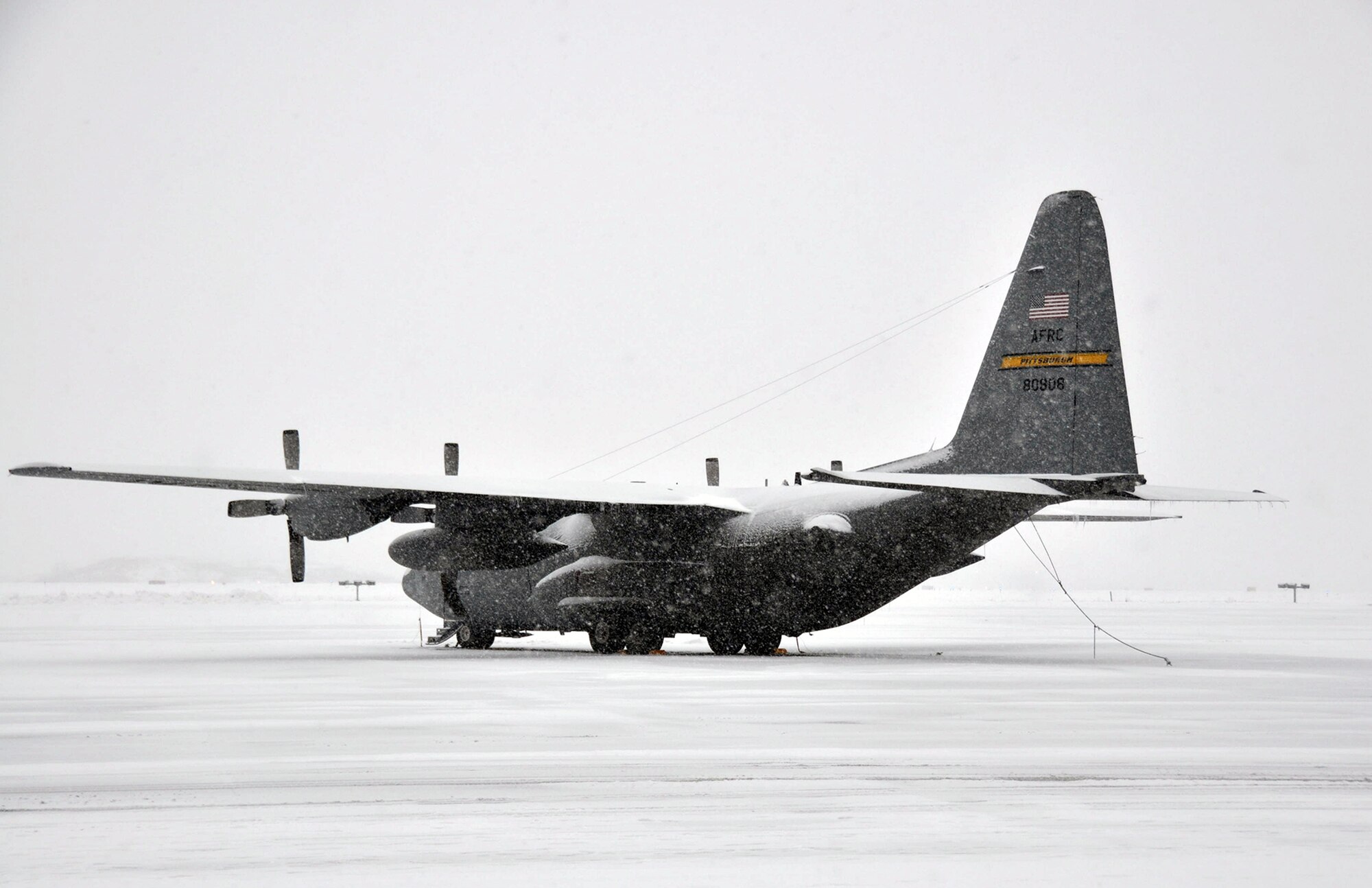A C-130H2 sits on the 911th Airlift Wing ramp, Feb. 4, 2012, as the Pittsburgh region experiences a snowfall of approximately five inches and icy conditions, resulting in the cancellation of an aeromedical orientation flight due to safety concerns.  Since the beginning of the new year 50 missions have been flown out of the 911th AW consisting of air drops, night and day tactical flights, assault zone landings, and also several cross country flights. “There have been only 18 cancelations due to weather since the first of the year, which is better than expected since we have had so much bad weather lately,” said Airfield Management. “They really have been putting the iron in the sky despite the bad weather.” (U.S. Air Force photo by Senior Airman Joseph E. Bridge/Released)