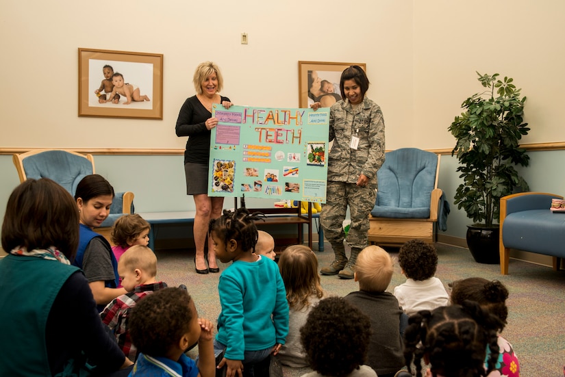 Gaye Adams, 628th Medical Group chief of preventive dentistry, and Staff Sgt. Bianca Cortez, 628th MDG dental technician, brief children about “Healthy Teeth,” Feb. 5, 2013, at the Child Development Center at Joint Base Charleston – Air Base, S.C. Developing good habits at an early age and scheduling regular dental visits helps children get a good start on a lifetime of healthy teeth and gums. (U.S. Air Force photo/Senior Airman George Goslin)