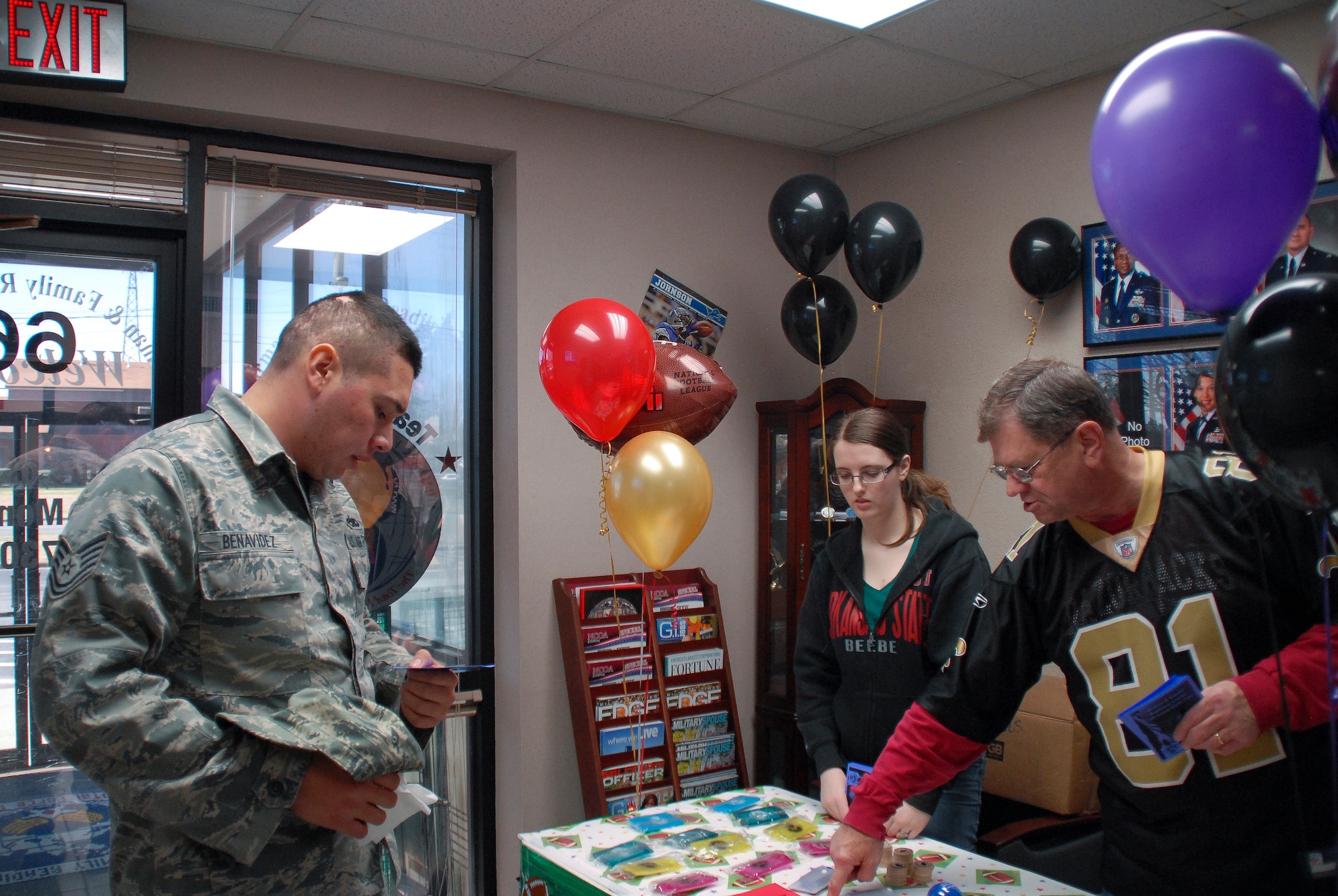 Tech. Sgt. Mark Benavidez, a 19th Maintenance Group quality assurance technician, learns about what’s available at the Airman and Family Readiness Center open house Feb. 1, 2013, at Little Rock Air Force Base, Ark. At the open house, the AFRC distributed information about more than 20 of their revamped programs, provided lunch and held a raffle drawing for prizes. (U.S. Air Force photo by Staff Sgt. Jacob Barreiro)