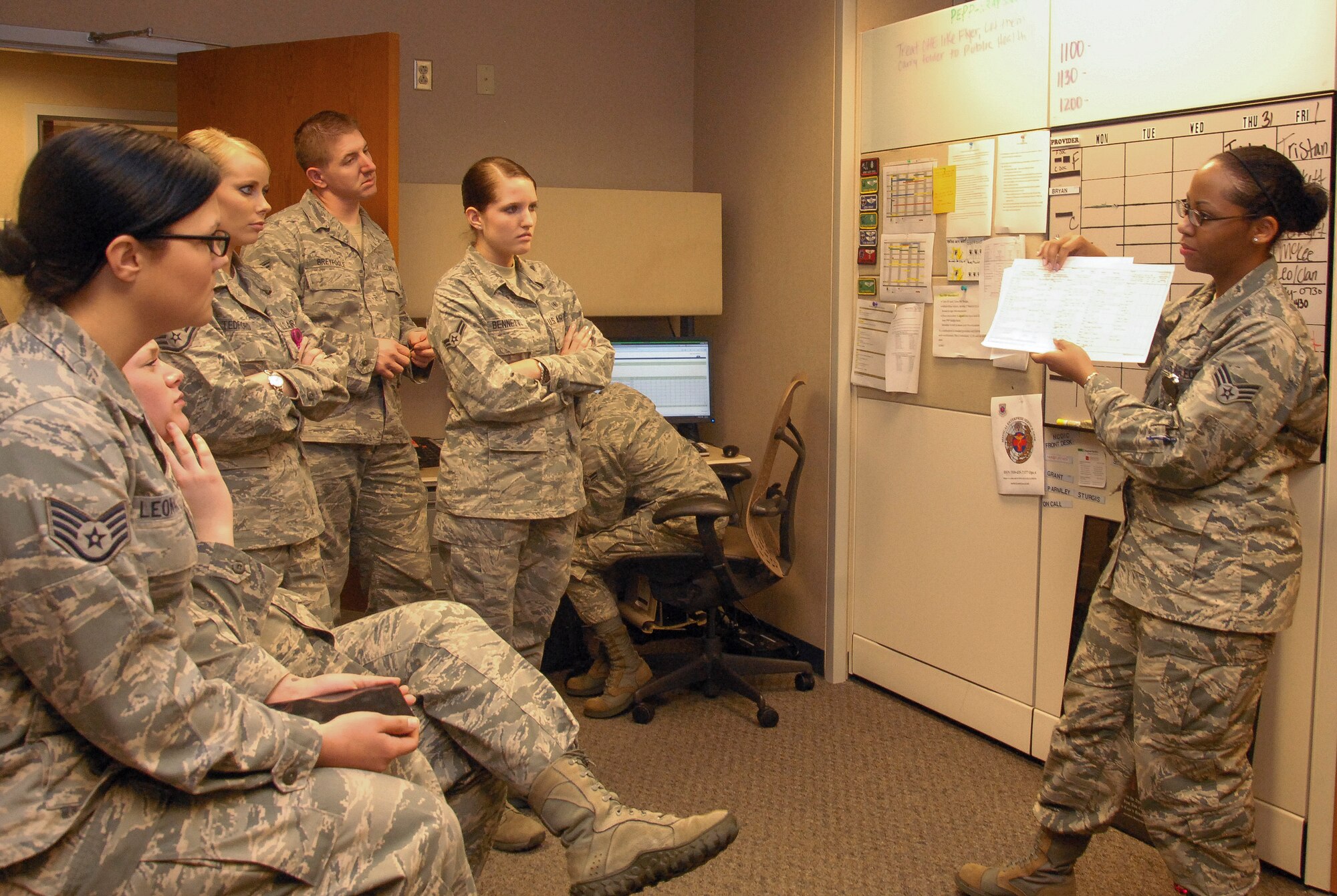 Senior Airman Brittani Newhouse, 19th Medical Support Squadron, trains flight medicine technicians on the proper way to fill an Air Force Form 1488 (injury log) Jan. 30. Newhouse, a Wichita, Kan., native, was recognized at a 2012 AF Medical Service conference for setting the standard in claims collections, leading to collections 28 percent above established goals. She has completed 43 credit hours towards her Bachelors of Science degree in Healthcare Management while maintaining a 3.9 grade point average. (U.S Air Force photo by Airman 1st Class Regina Agoha)  