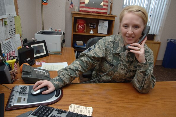 Master Sgt. Stephanie Rosenberg, 319th Medical Operations Squadron superintendent, answers a call Feb. 5, 2013, at her office on Grand Forks Air Force Base, N.D. Rosenberg was named the Grand Forks Air Force Base Warrior of the Week for the second week of February 2013. (U.S. Air Force photo/Senior Airman Luis Loza Gutierrez)