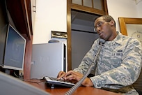 U.S. Air Force Staff Sgt. James Reese, 902nd Communications Squadron client support systems supervisor performs a setup of a workstation upgrade Feb. 7, 2013, at Joint Base San Antonio-Randolph.  (U.S. Air Force photo by Joshua Rodriguez/Released)