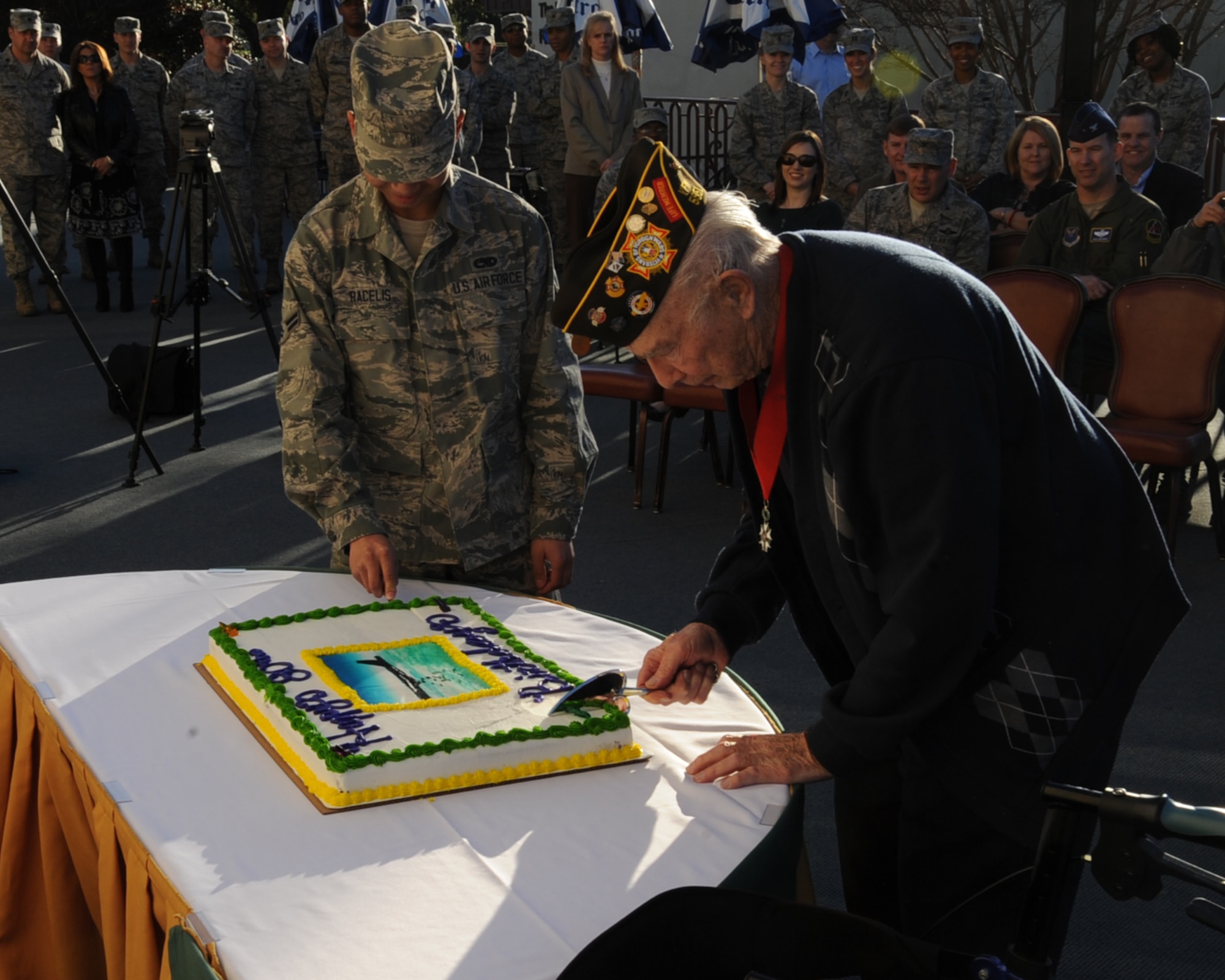 (Ret.) Col. Steve dePyssler, Barksdale Retiree Affairs Office director, and Airman 1st Class Ezekiel Racelis, 2nd Maintenance Squadron egress apprentice, cut a cake during the Barksdale Air Force Base 80th Anniversary celebration here., Jan. 31. Barksdale field opened Feb. 2, 1933 and later became Barksdale Air Force Base in 1948. It was named after Lt. Eugene Hoy Barksdale. (U.S. Air Force photo/Senior Airman Sean Martin)