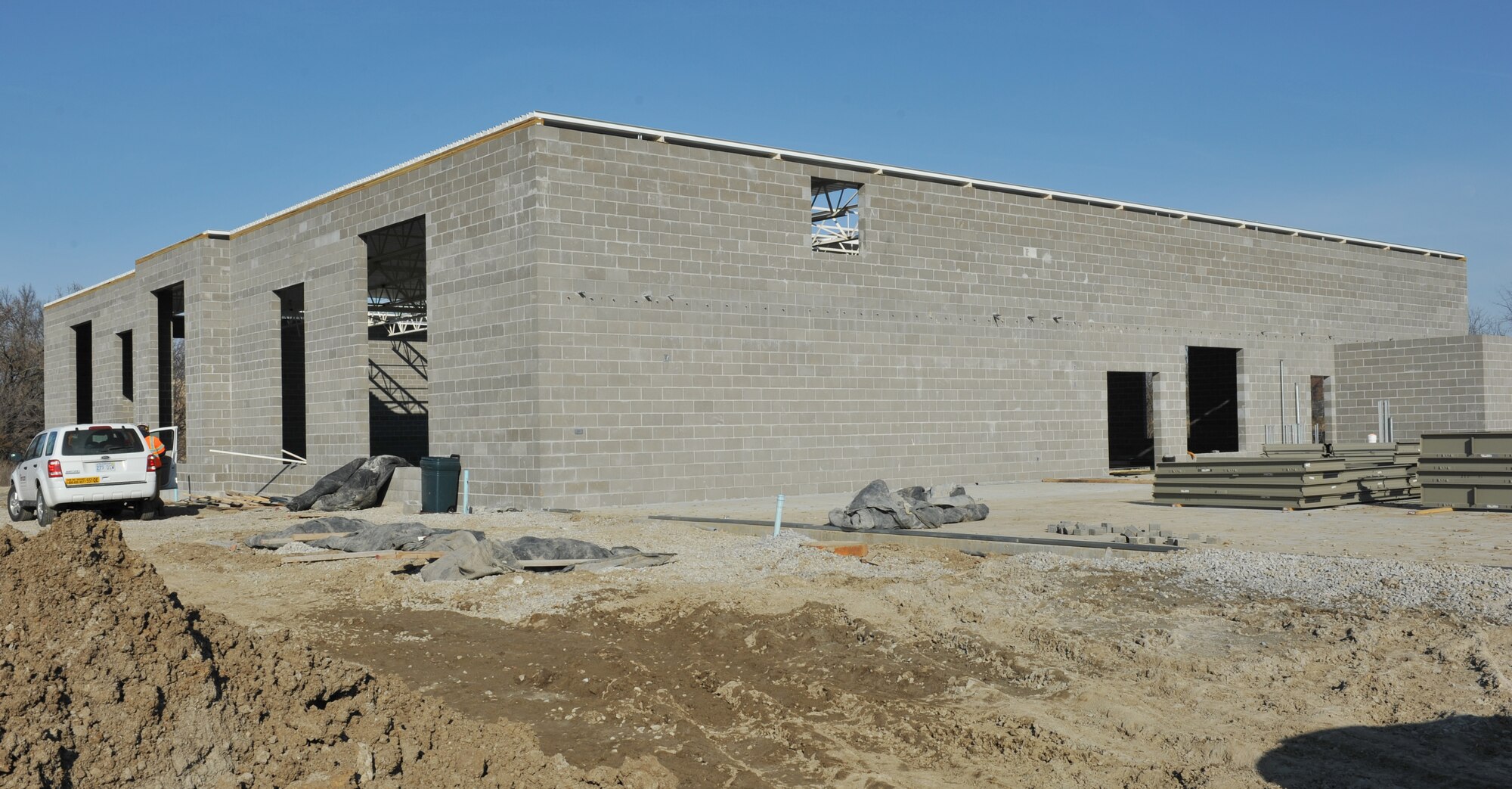 WHITEMAN AIR FORCE BASE, Mo. -- Balfour Beatty Communities construction workers build on the foundation for a new fitness building, Jan. 22.  The new facility will contain an indoor pool, a workout area, locker rooms and restrooms to supplement other base facilities.  (U.S. Air Force photo/Heidi Hunt)
