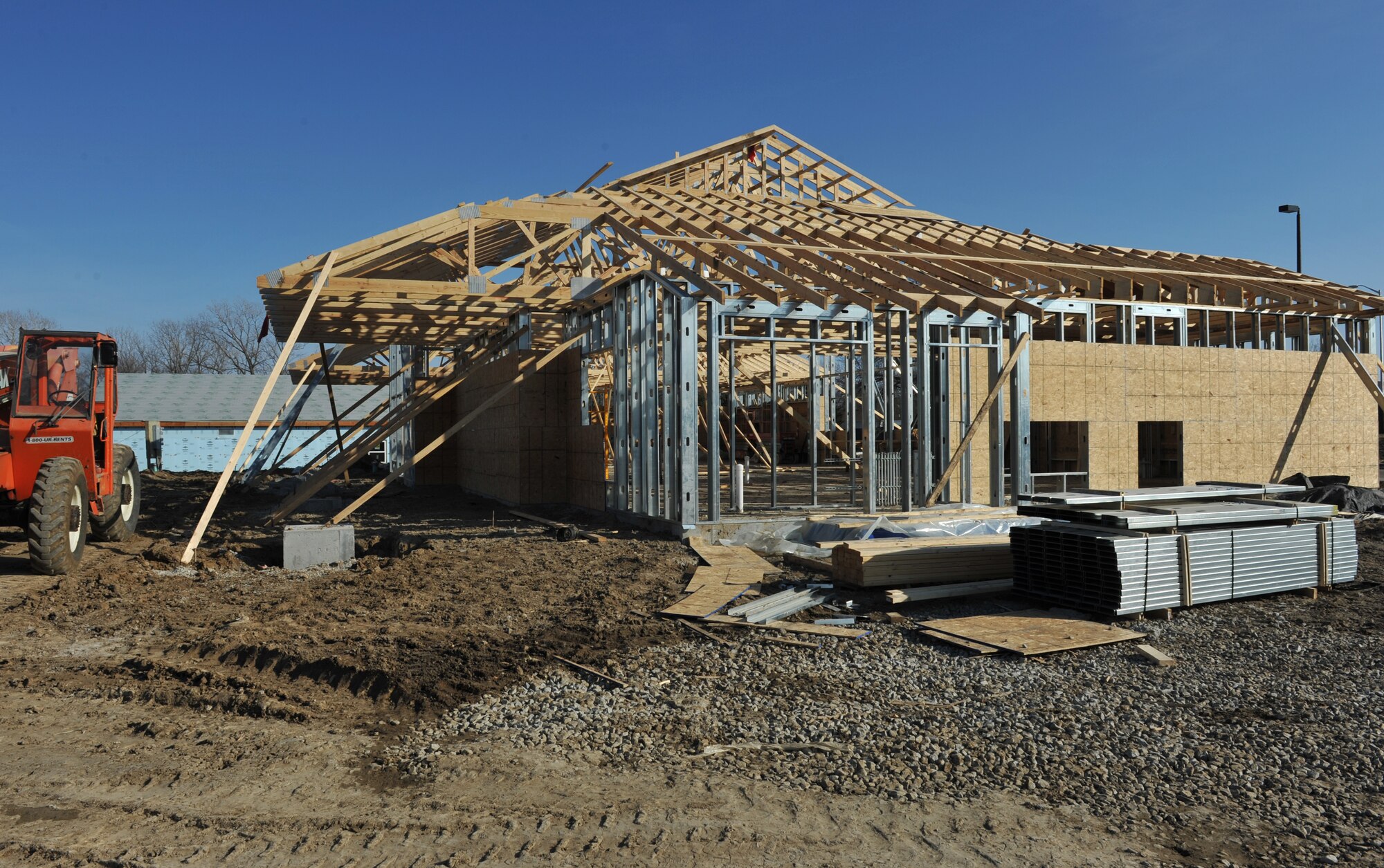 WHITEMAN AIR FORCE BASE, Mo. -- Balfour Beatty Communities construction workers build on the foundation for a new community management office, Jan. 22.  The new facility will have several offices, a conference room and a room for greeting residents. (U.S. Air Force photo/Heidi Hunt)