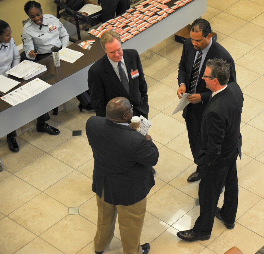 Community leaders and small business owners from the local community mingle at the Jacob A. Smart building, Joint Base Andrews, Md, during Business Summit 2013 on Feb. 5. The11th Wing hosted the event which gives the community a better understanding of the impact Andrews has on the community. (U.S. Air Force photo/Staff Sgt. Amber Russell)
