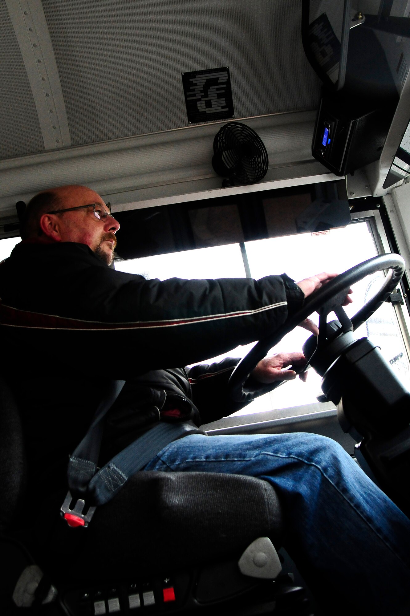 Ruegger Gerhard, 86th Vehicle Readiness Squadron bus driver, drives the base shuttle on Ramstein Air Base, Germany, Jan. 30, 2013. The base shuttle runs from 6 a.m. to 6 p.m. to allow Airmen and family members to get to appointments or across base during the day. (U.S. Air Force photo/Airman 1st Class Hailey Haux)