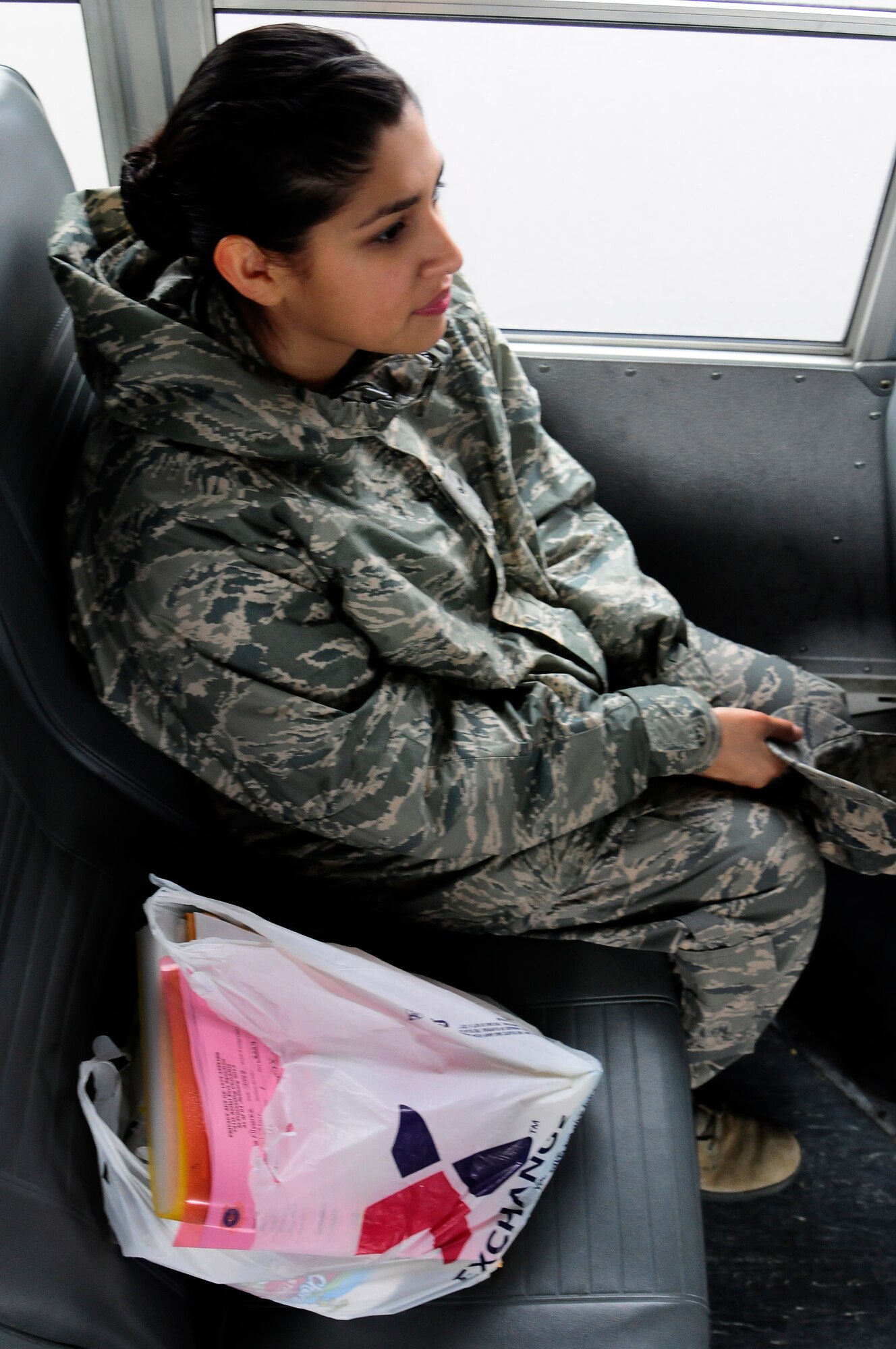 Airman 1st Class Katrina Alvarez, 721st Aerial Port Squadron cargo processing, utilizes the base shuttle to get around Ramstein Air Base, Germany, Jan. 30, 2013. The base shuttle runs from 6 a.m. to 6 p.m. to allow Airmen and family members to get to appointments or across base during the day. (U.S. Air Force photo/Airman 1st Class Hailey Haux)