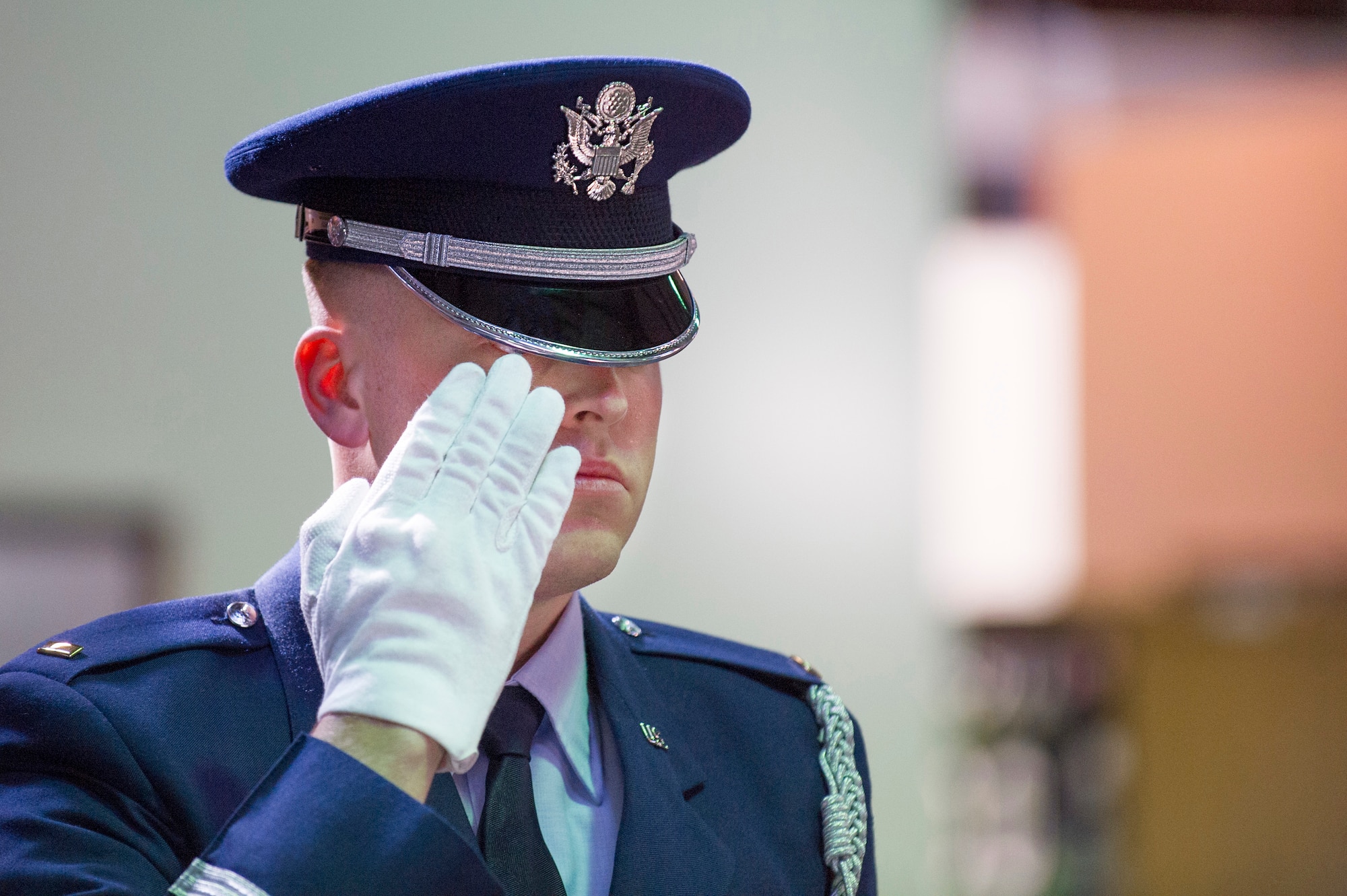 Blue Flight Honor Guard Company Grade Officer of the Year nominee, 2nd Lt Dan Griffith, 45 SCS, salutes the flag after presenting it to the next of kin during the Honor Guard Airman of the Year Board, which consisted of a total of 8 nominees competing in the Airmen, noncommissioned officer and Company Grade Officer categories. Participants had a uniform inspection, answered a series of questions and performed in a scenario unknown to them until the board presented it. (U.S. Air Force Photo/Matthew Jurgens.)