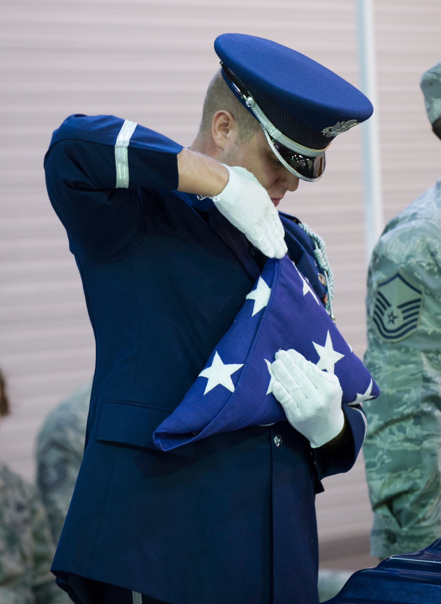 White Flight Honor Guard Company Grade Officer of the Year nominee, 1Lt Gavin Brawley, 5 SLS, executes a full-dress sequence following the six-person flag fold during the Honor Guard Airman of the Year Board, which consisted of a total of 8 nominees competing in the Airmen, noncommissioned officer and Company Grade Officer categories. Participants had a uniform inspection, answered a series of questions and performed in a scenario unknown to them until the board presented it. (U.S. Air Force Photo/Matthew Jurgens.)