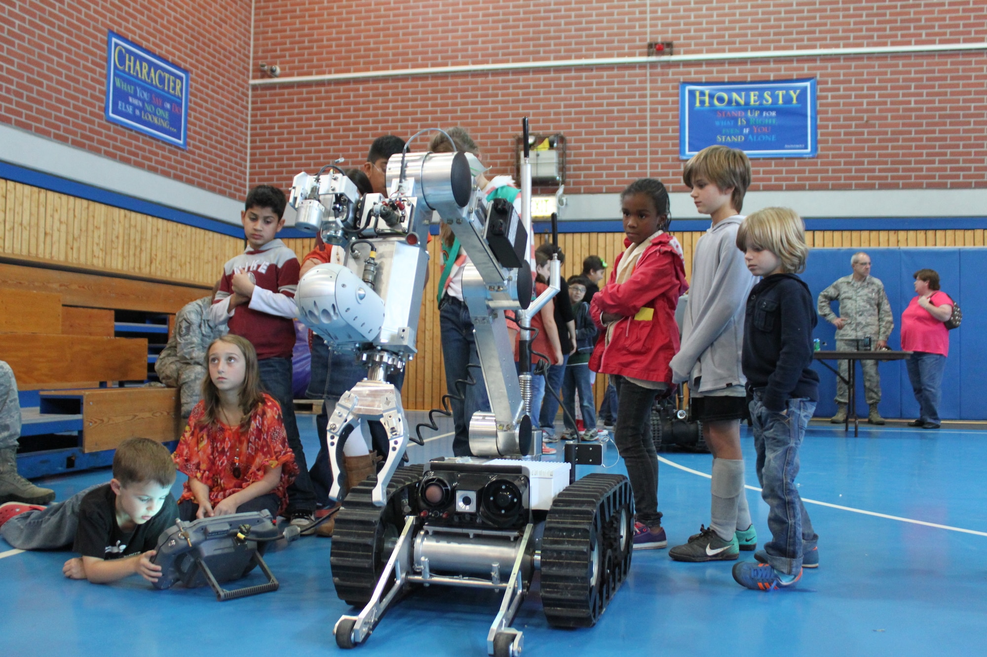 Youths learn about the real-world application of robotics technologies on Ramstein Air Base, Germany, Oct. 10, 2012. The 4-H club sponsors an annual national youth science day which allows 4-H’ers all throughout the world to conduct similar experiments. (Photo courtesy of 86th Force Support Squadron)