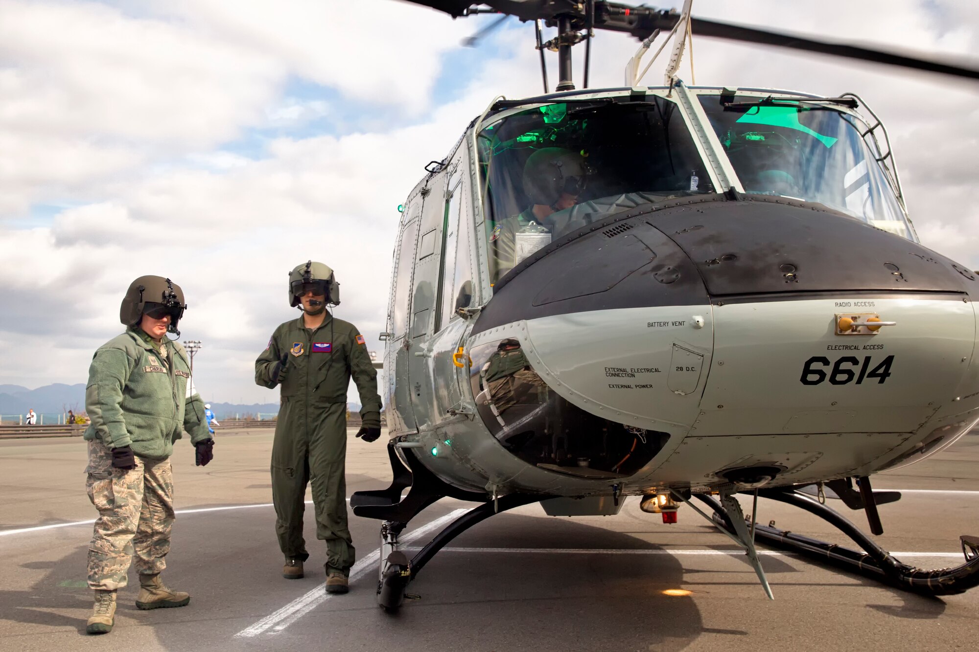 SHIZUOKA PREFECTURE, Japan -- From left to right, Staff Sgt. Leslie Charles, 374th Medical Operations Squadron independent duty medical technician, and Staff Sgt. Arturo Fernandez, 459th Airlift Squadron flight engineer, walk around a simulated emergency landing zone at the Shin-Tomei expressway's service area, Shizuoka Prefecture, Japan, Feb. 5, 2013. (U.S. Air Force photo by Osakabe Yasuo)