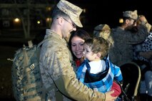 A Marine with Combat Logistics Battalion 2, 2nd Marine Logistics Group greets his family after returning from the unit’s deployment to Afghanistan during a homecoming celebration aboard Camp Lejeune, N.C., Jan. 20, 2013. The unit spent approximately six months performing logistics operations in Afghanistan, and numerous members of 2nd MLG’s senior leadership showed up early in the morning to welcome the troops home. 