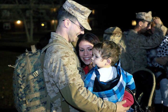 A Marine with Combat Logistics Battalion 2, 2nd Marine Logistics Group greets his family after returning from the unit’s deployment to Afghanistan during a homecoming celebration aboard Camp Lejeune, N.C., Jan. 20, 2013. The unit spent approximately six months performing logistics operations in Afghanistan, and numerous members of 2nd MLG’s senior leadership showed up early in the morning to welcome the troops home. 