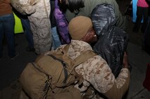A Marine with Combat Logistics Battalion 2, 2nd Marine Logistics Group hugs members of his family during the unit’s homecoming celebration Feb. 1, 2013. Approximately 600 Marine and sailors with the battalion assisted NATO operations during nearly six months in Afghanistan. 