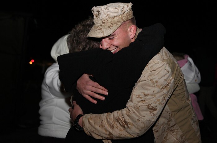 A Marine greets loved ones during a homecoming celebration for the servicemembers with Combat Logistics Battalion 2, 2nd Marine Logistics Group aboard Camp Lejeune, N.C., Feb. 1, 2013. Approximately 290 servicemembers returned in the second of three waves of Marines and sailors returning to the base. 