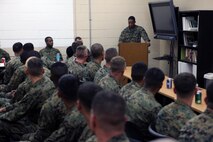 (Top) Sgt. Maj. Anthony L. Crutcher, the sergeant major of Combat Logistics Regiment 27, 2nd Marine Logistics Group speaks to the graduating class during the Corporals Course mess night aboard Camp Lejeune, N.C., Feb. 6, 2013. Crutcher emphasized the importance of a NCO and commended them for their hard work. 