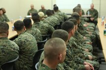 The graduating class, Class 020-13, listen as Sgt. Maj. Anthony L. Crutcher, the sergeant major of Combat Logistics Regiment 27, 2nd Marine Logistics Group, speaks during a Corporals Course mess night aboard Camp Lejeune, N.C., Feb. 6, 2013. The sergeant major of the regiment talked about key points about critical thinking, improved leadership and ability to make sound decisions before returning to their respective units.