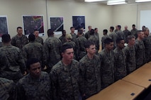 Three squads of Marines with 2nd Marine Logistics Group filled into the room, stood at attention and prepared for their last meal together during the Corporals Course mess night aboard Camp Lejeune, N.C., Feb. 6, 2013. During the course, noncommissioned officers with the MLG underwent a challenging physical fitness program, classroom instruction and a field exercise, where they participated in simulated engagements against their peers. 