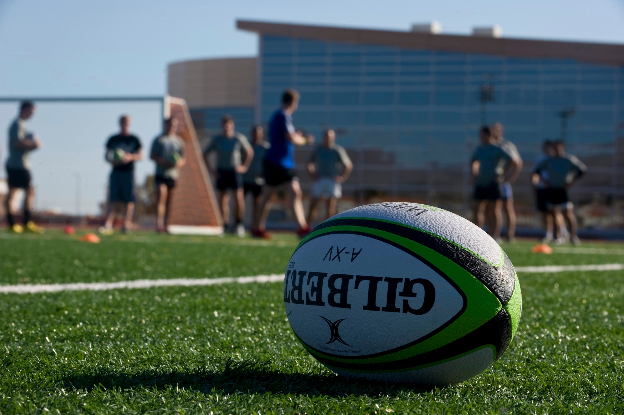 Members from U.S. military rugby teams practice drills during the military rugby clinic Feb. 6, 2013, at Nellis Air Force Base, Nev. Teams attending the clinic are preparing to play in the 2013 USA Sevens Rugby Tournament being held in Las Vegas Feb. 8-10, 2013. (U.S. Air Force photo by Senior Airman Matthew Lancaster)