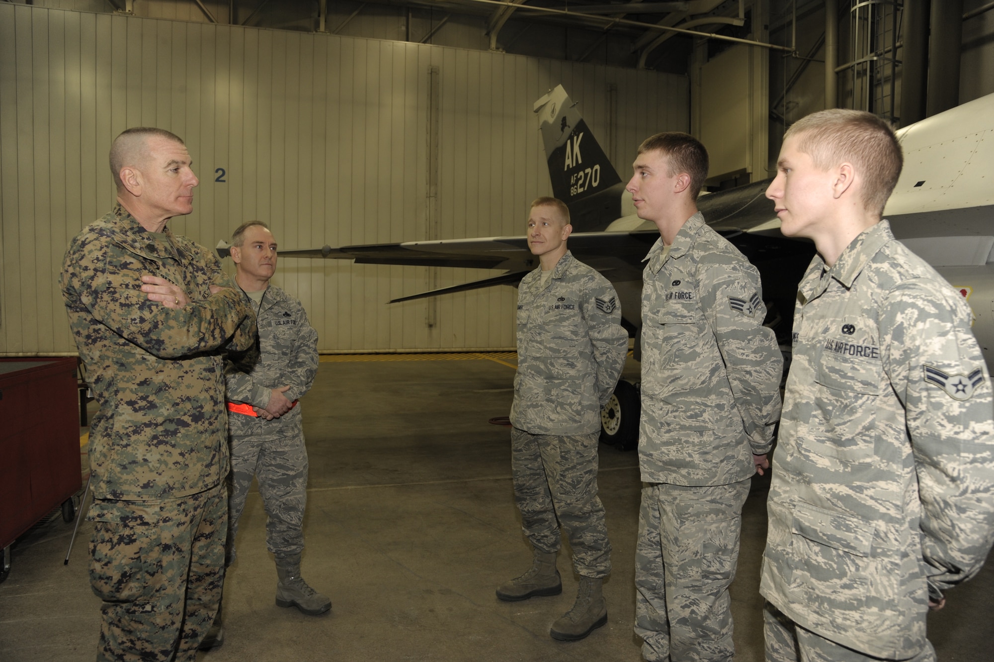 U.S. Marine Corps Sgt. Maj. Bryan Battaglia, senior enlisted advisor to the chairman of the Joint Chiefs of Staff, meets with Airmen from the 354th Aircraft Maintenance Squadron during a visit to Eielson Air Force Base, Alaska Jan. 30, 2013. Battaglia toured the base to understand the unique environment Eielson offers and spent time talking to the Iceman Team about the CJCS’ priorities and stressed the importance of resiliency and total force fitness. (U.S. Air Force Photo/Airman 1st Class Peter Reft)
