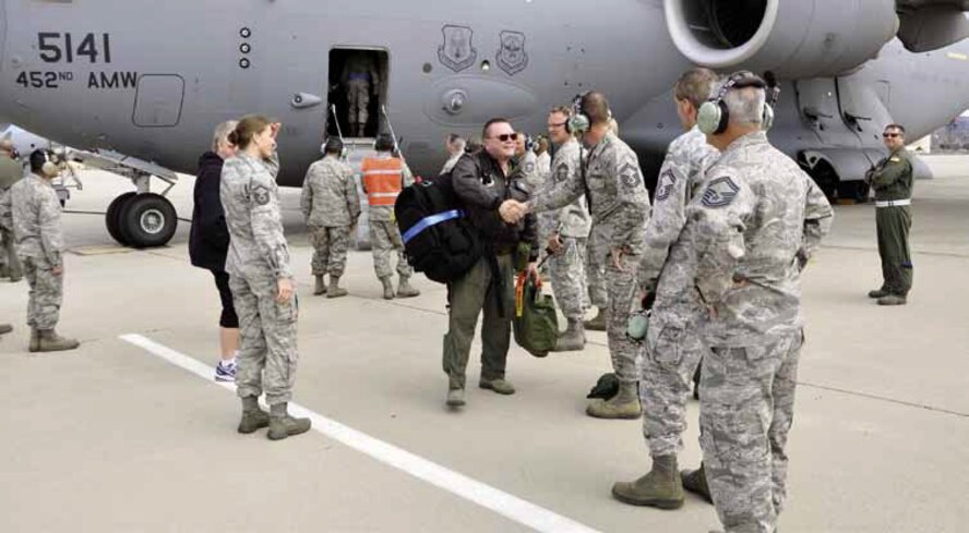 Colonel Samuel Mahaney (center), 452d Air Mobility Wing commander, is greeted by March members after returning from the Operational Readiness Inspection, Feb. 2. (U.S. Air Force photo by Master Sgt. Linda Welz)