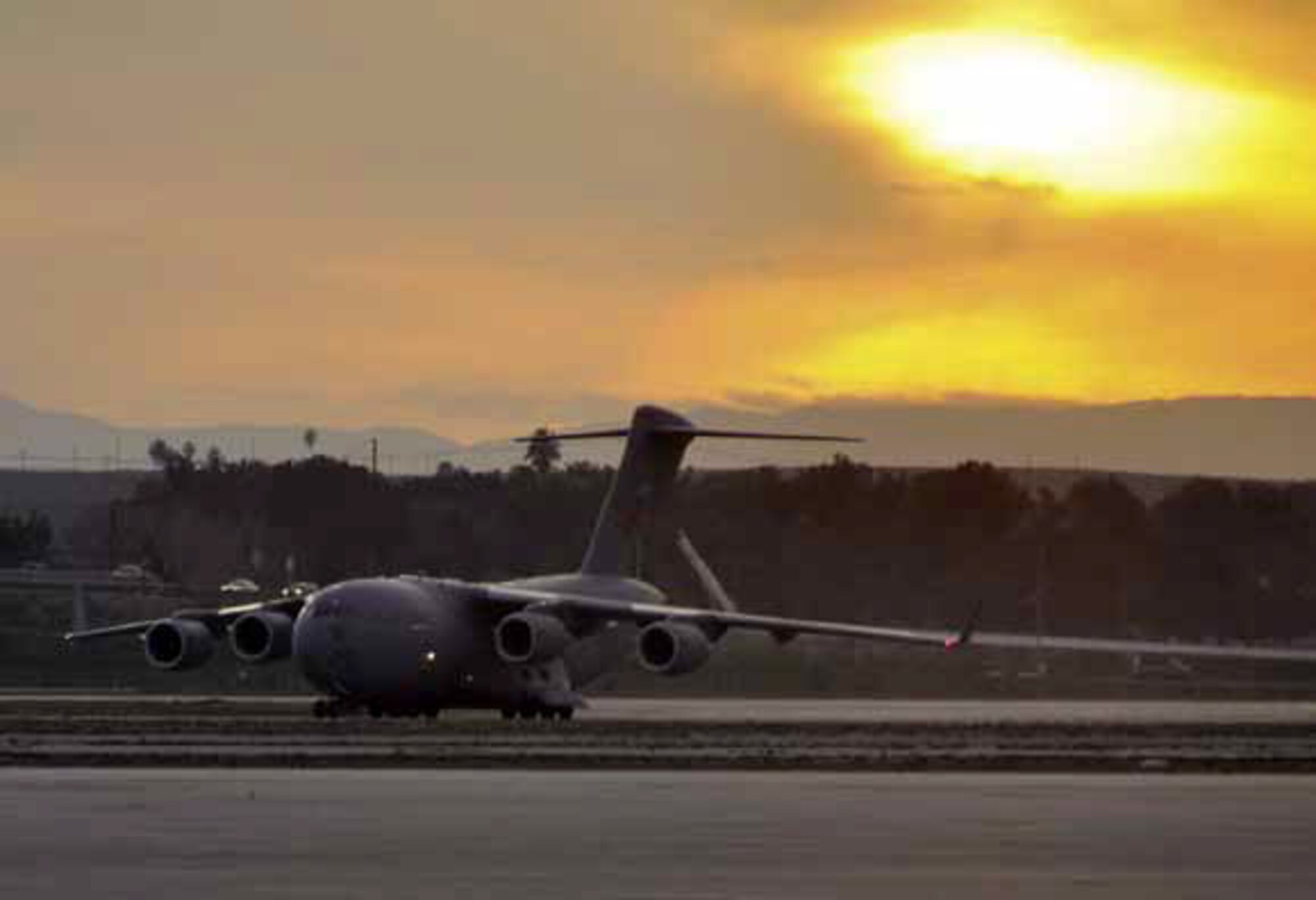 The mighty C-17 Globemaster III landed at March Field just before sunset, manifested with exhausted warriors returning from the week long Operational Readiness Inspection, held in Gulfport, Miss., Feb. 1. (U.S. Air Force photo by Darnell Gardner)