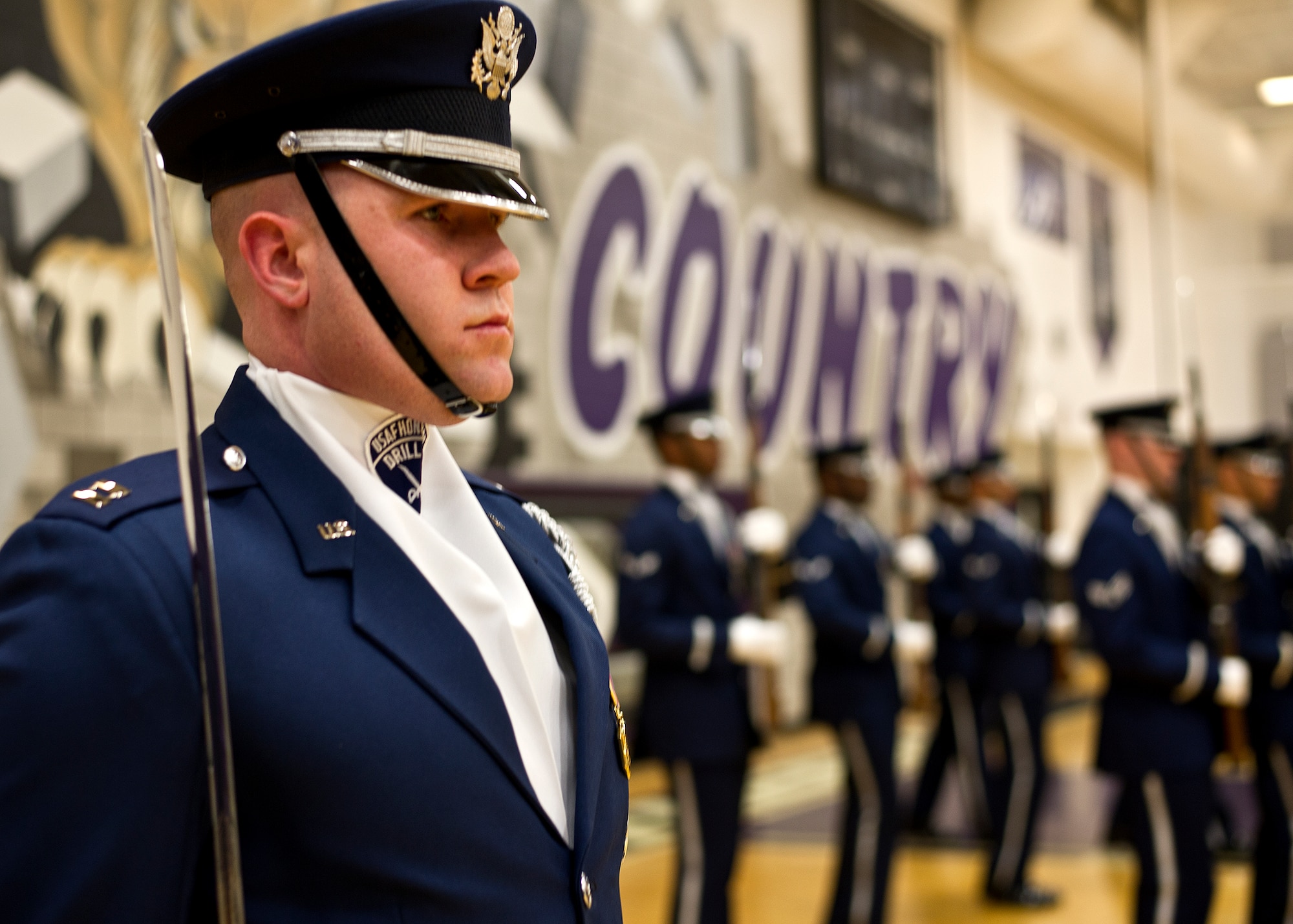 Capt. Alexander Stanton, U.S. Air Force Honor Guard Drill Team commander, stands at attention alongside the members of the Drill Team at a performance Feb. 6, 2013 at Battlefield High School in Haymarket, Va. The performance was Stanton’s final performance with the Drill Team. (U.S. Air Force photo/ Senior Airman Bahja Joi Jones)