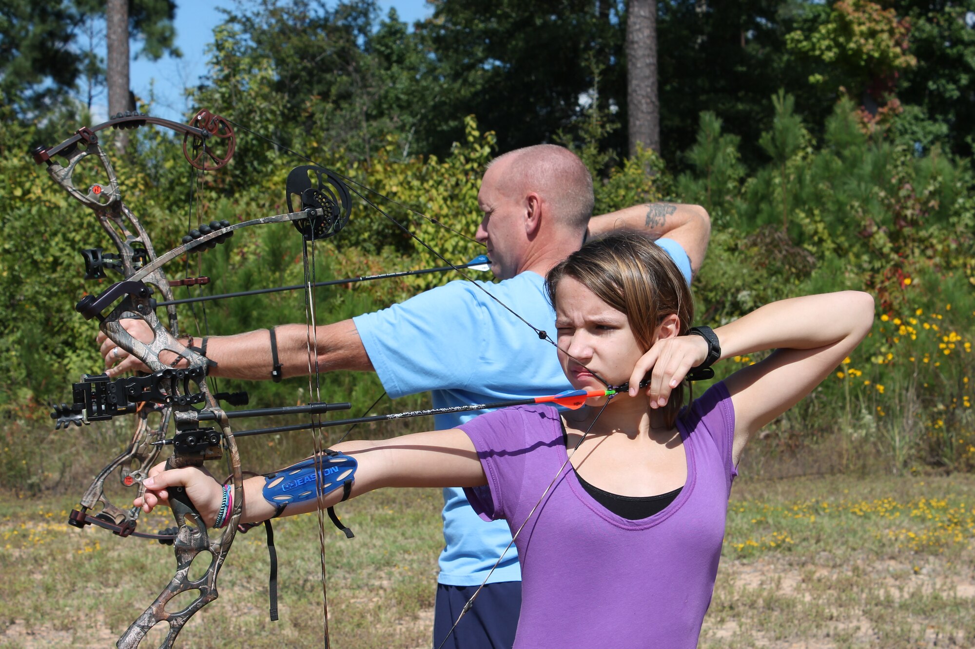 Air Force Global Strike Command Chief Master Sgt. Brian Hornback and his daughter practice archery together. The father-daughter team began archery as a way to spend more time with each other. (Courtesy photo)