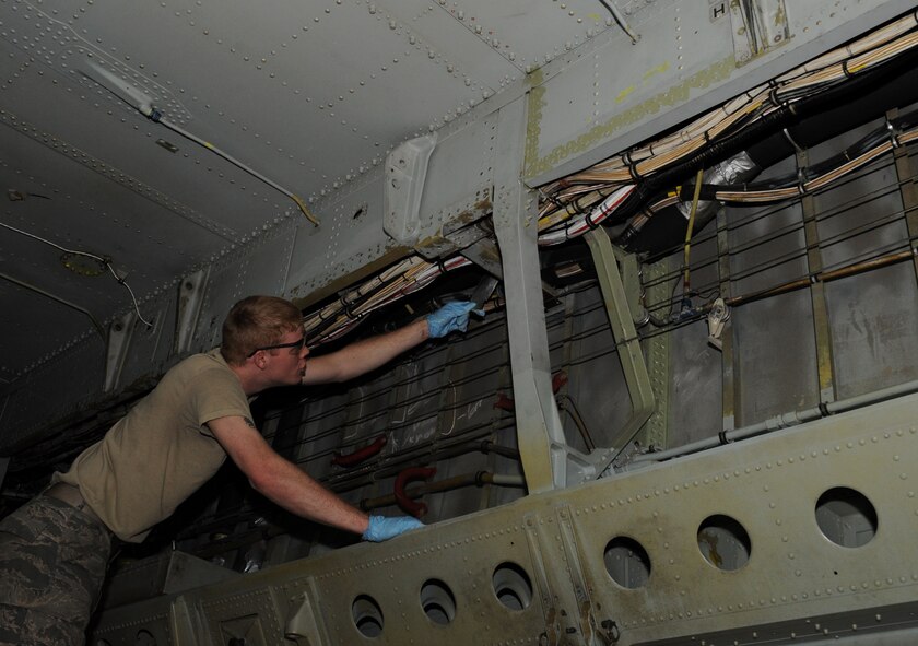 Airman 1st Class Shelby Bates, 2nd Maintenance Squadron Fabrication Flight, looks for corrosion inside a B-52H Stratofortress on Barksdale Air Force Base, La., Feb. 8. When corrosion is found on a B-52, 2 MXS Fab Flight Airmen will grind the corroded area to bare metal and place a primer over it to prevent further corrosion. (U.S. Air Force photo/Airman 1st Class Benjamin Gonsier)