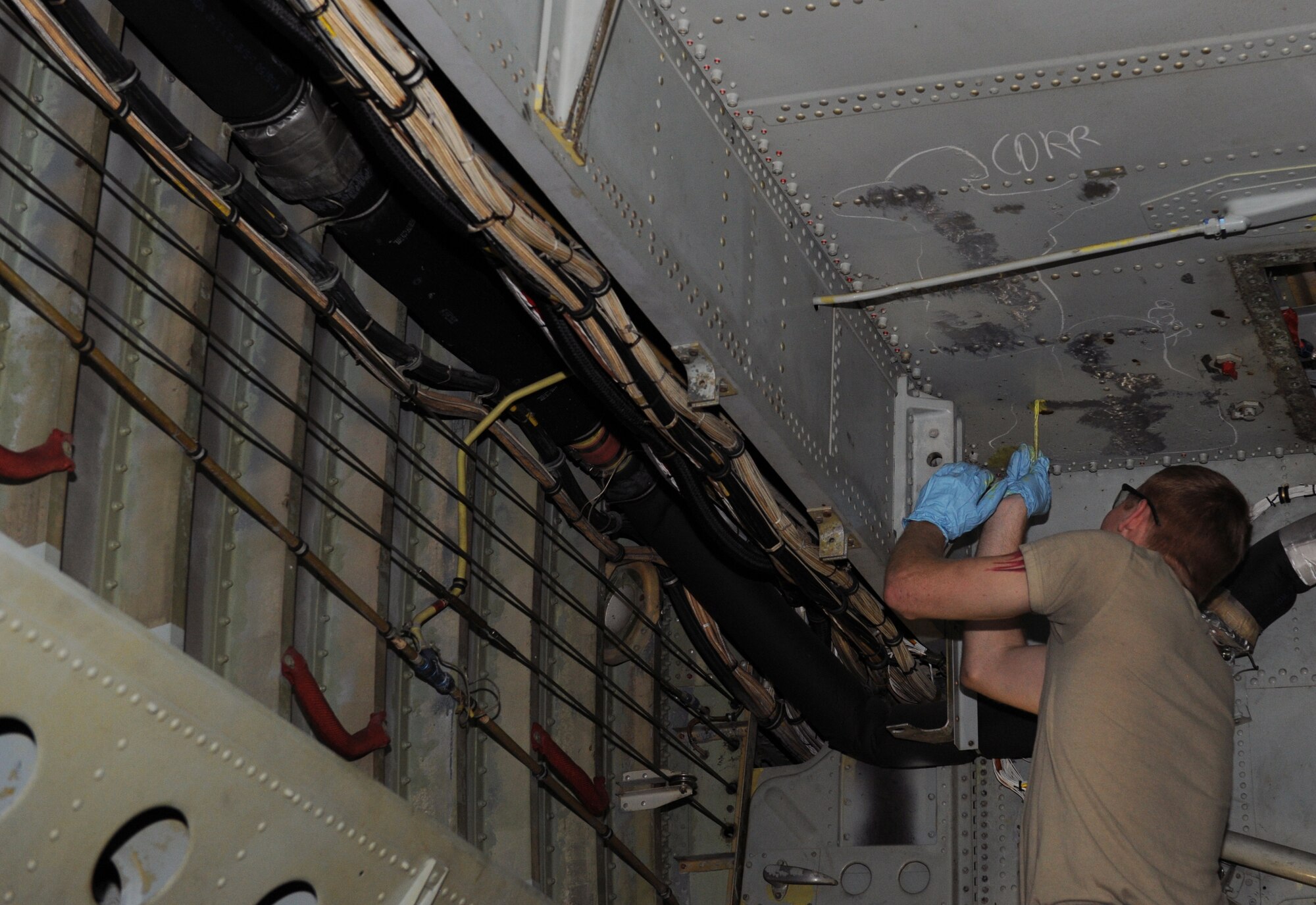 Airman 1st Class Shelby Bates, 2nd Maintenance Squadron Fabrication Flight, places a primer over an area where corrosion once was on Barksdale Air Force Base, La., Feb. 8. When corrosion is found on a B-52H Stratofortress, 2 MXS Fab Flight Airmen will grind the corroded area to bare metal and place a primer over it to prevent further corrosion. (U.S. Air Force photo/Airman 1st Class Benjamin Gonsier)
