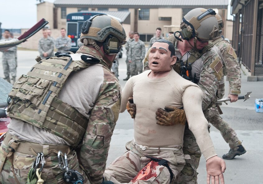 U.S. Air Force pararescuemen from the 38th Rescue Squadron rescue a dummy during a breach and rescue demonstration at Moody Air Force Base, Ga., Feb. 7, 2013. The demonstration gave insight to what the Airmen of the 38th RQS do for a living. (U.S. Air Force Photo by Airman Paul Francis/Released
