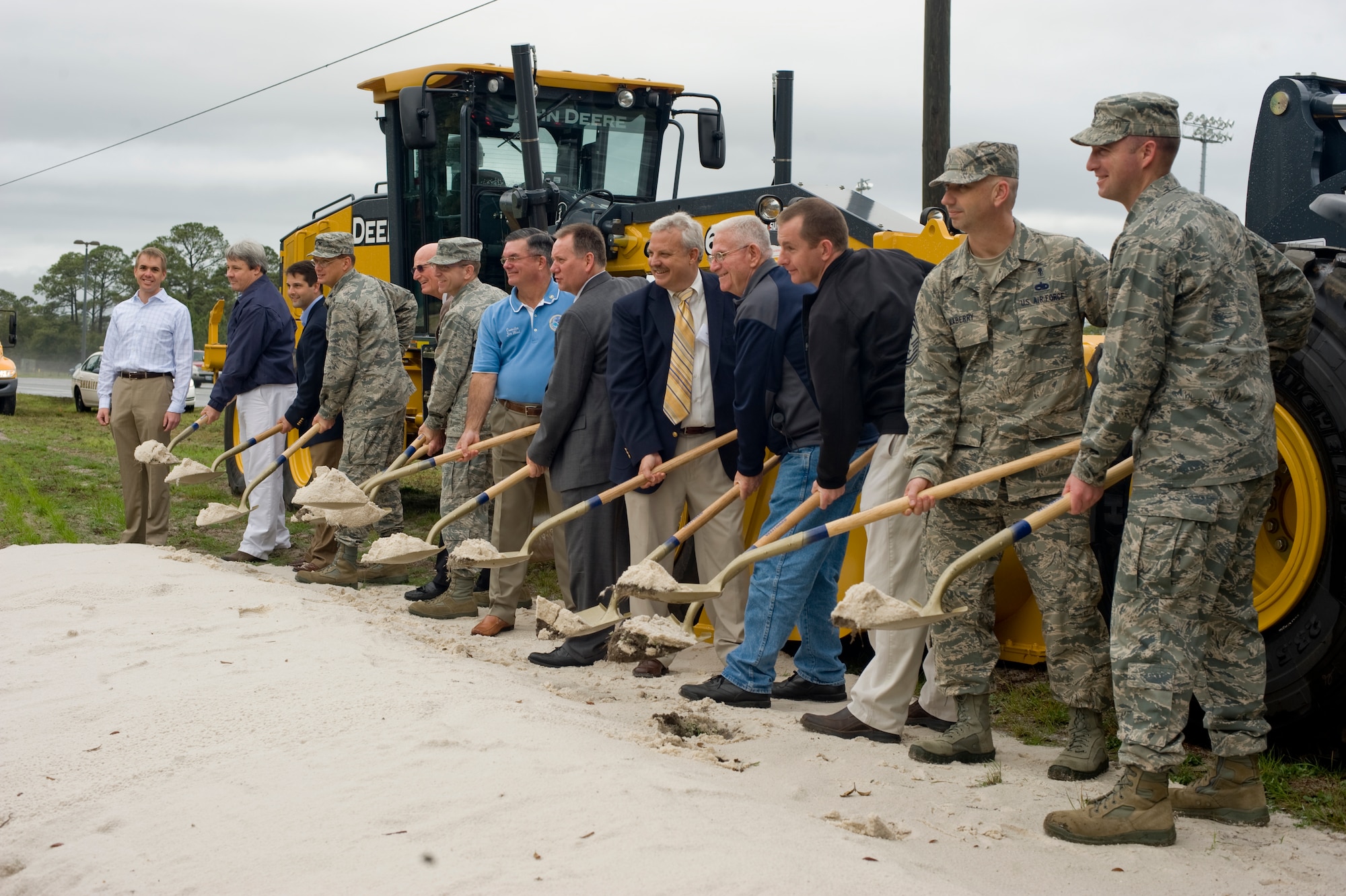 Hurlburt Field members and community leaders shovel sand to kick off the construction of the U.S. 98/Cody Avenue Interchange during a ceremony outside the Soundside Club at Hurlburt Field, Fla., Feb. 7, 2013. The project will begin midway through 2013 and is expected to be completed by late 2014. (U.S. Air Force Photo/Airman 1st Class Hayden K. Hyatt) 