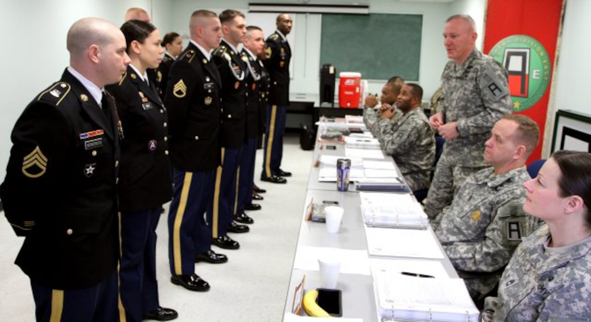 Candidates are briefed from Command Sgt. Maj. Dennis E. Defreese, First Army Division East Command Sergeant Major, before they board for the Sergeant Audie Murphy Club board Jan. 25, 2013, at Joint Base McGuire-Dix-Lakehurst, N.J. The Sergeant Audie Murphy Club, a U.S. Army organization for enlisted NCOs, recognizes Soldiers whose leadership achievements and performance merit special attention. (U.S. Army photo by Sgt. Courtney A. Selig/Released)