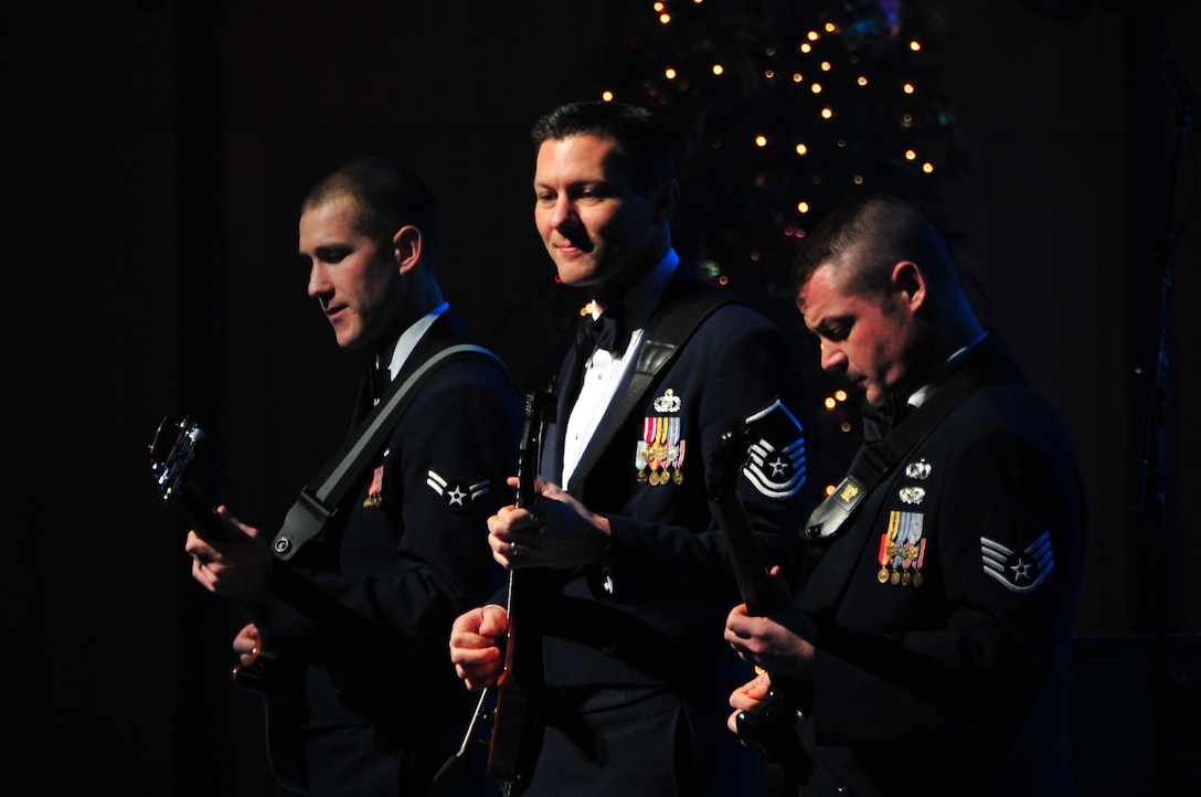 Night Wing's Airman First Class Lee Heerspink, Master Sergeant Rick Baisden and Staff Sergeant Dan Bragdon perform "A Christmas Rock Medley"