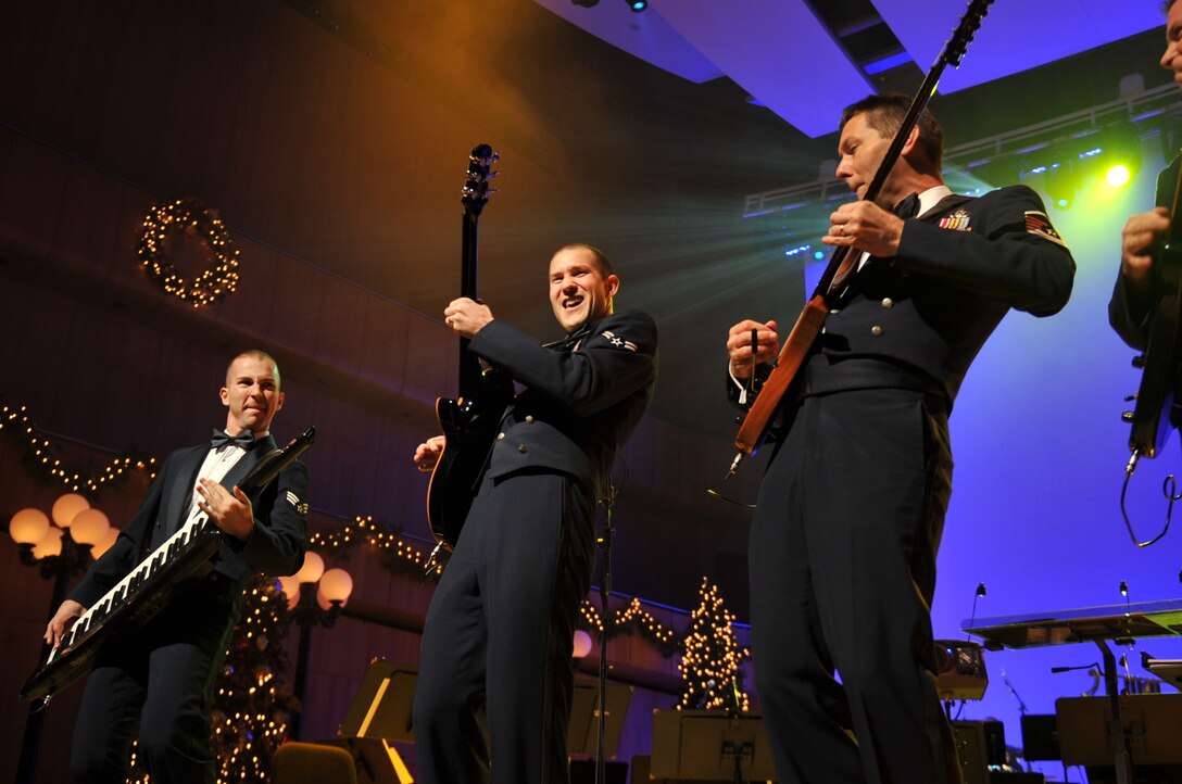 Senior Airman Ryan Rager, Airman First Class Lee Heerspink, and Master Sergeant Rick Baisden of Night Wing perform "A Christman Rock Medley"