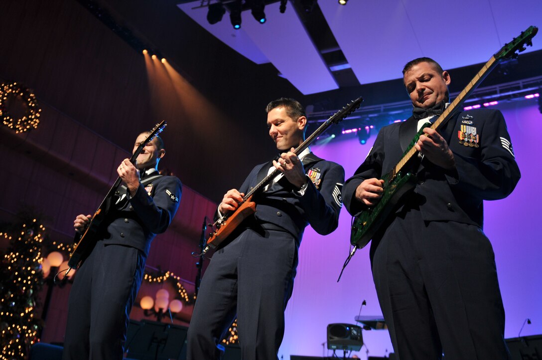 Night Wing's Airman First Class Lee Heerspink, Master Sergeant Rick Baisden and Staff Sergeant Dan Bragdon perform "A Christmas Rock Medley"