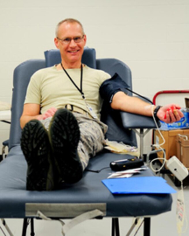 Chief Master Sgt. Jeffrey Managhan, Aircrew Flight Equipment Superintendent, with the 180th Fighter Wing, donates blood for the first time in his 26 years in the Air Force at an American Red Cross Blood Drive, hosted by the 180th FW, Jan. 29, 2013. The 180th FW hosts blood drives three times a year in support of our local communities. The wing collects an average of 30-40 units of blood each drive. (U.S. Air Force photo by Master Sgt. Beth Holliker/released)