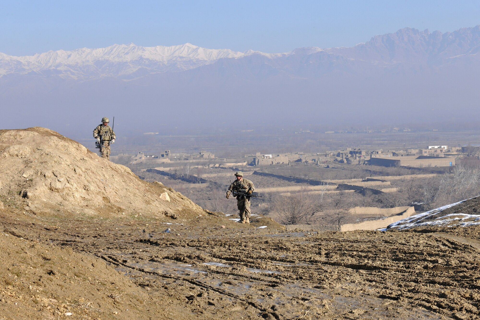 Squadron and the 755th Expeditionary Security Forces Squadron travel to help fix the broken water wells in villages near Bagram Airfield, Afghanistan, Jan. 26, 2013. These Airmen traveled by foot in small groups over dirt roads and had to carry all their tools and equipment by hand along with their weapons. (U.S. Air Force photo/Senior Airman Chris Willis)
