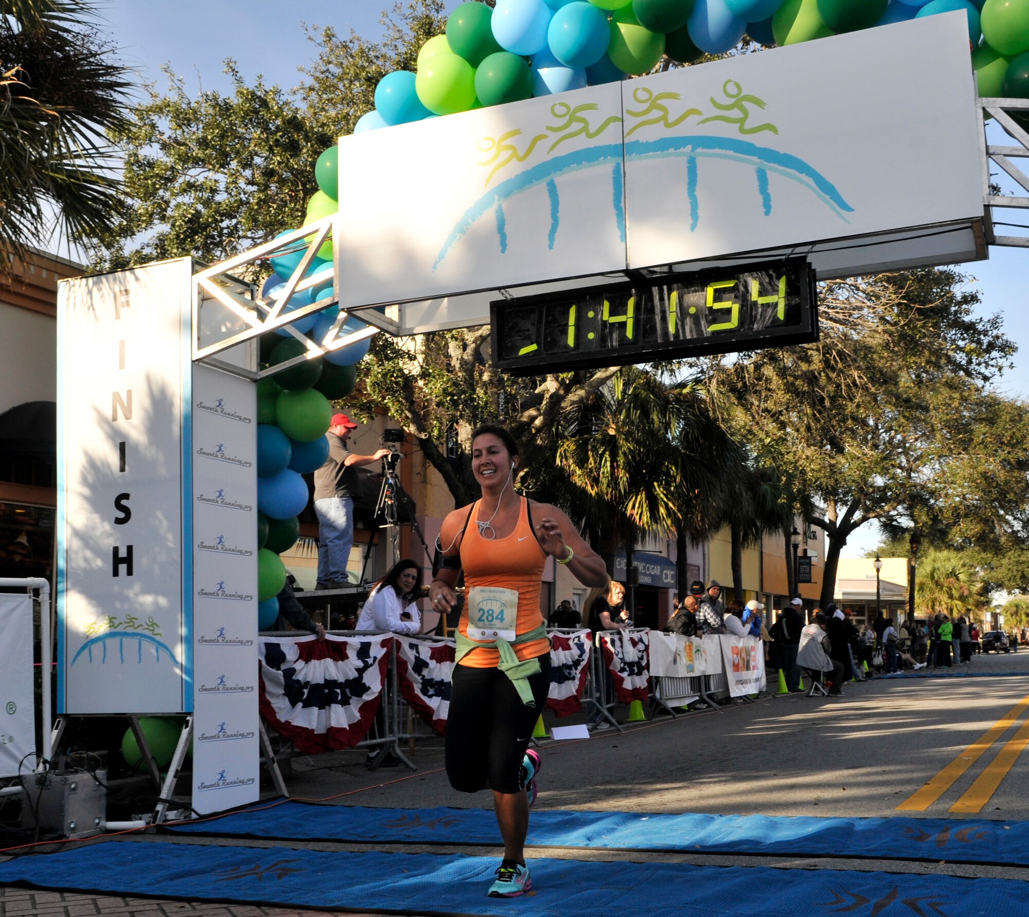 Senior Airman Mandy Forshaw, 920th Rescue Wing, medical technician, crosses the finish line ahead of all other 920th Rescue Wing runners. Forshaw joined 1000’s of local and afar athletes to participate in the Melbourne Music Marathon half marathon.  (U.S. Air Force photo/Tech. Sgt. Peter Dean)