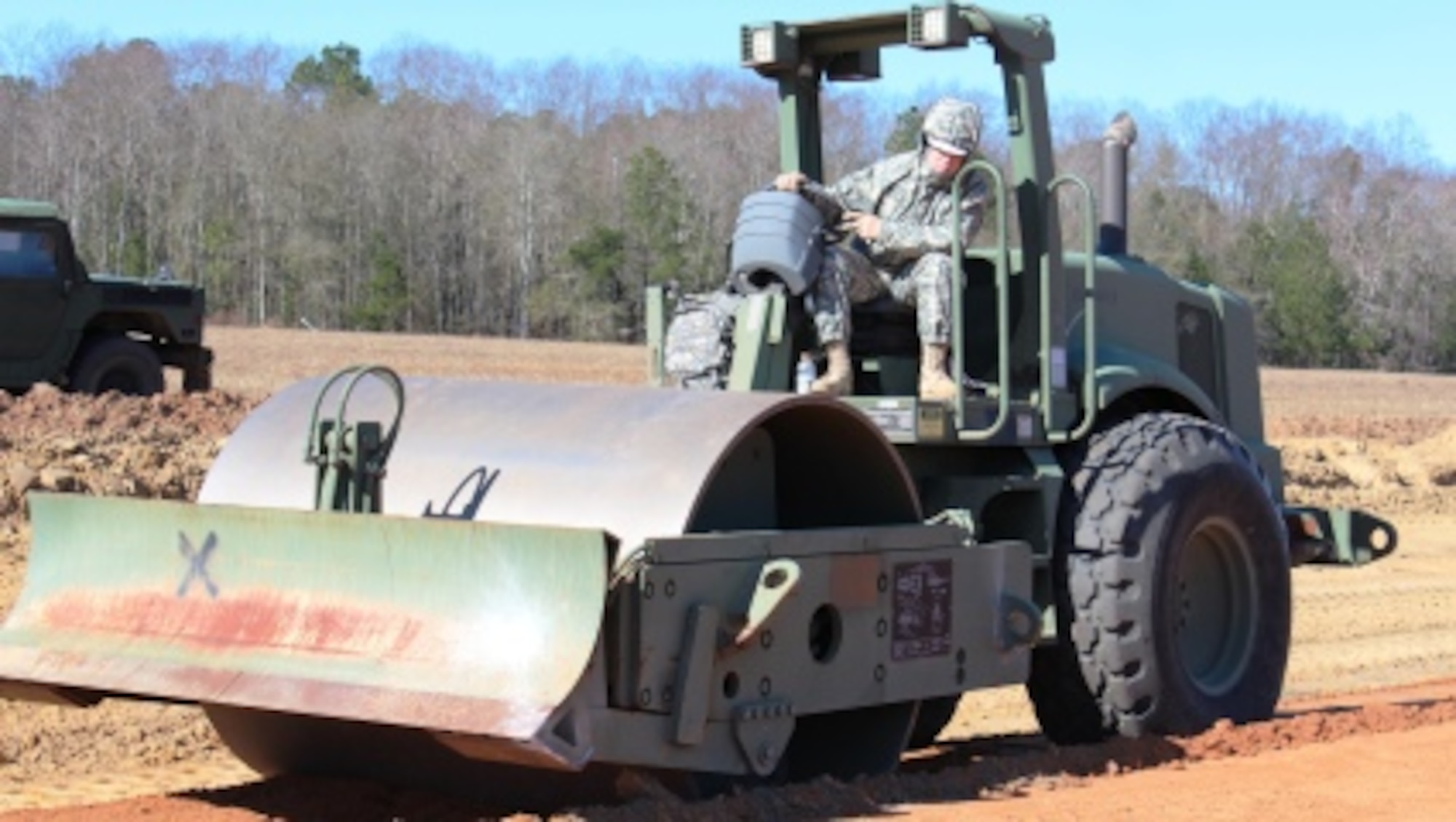 National Guard Red Horse Civil Engineers from New Mexico operate heavy equipment across the wide expanse of the Remagen DZ at Fort Stewart, GA, bringing the vital assault landing strip back to life. Georgia National Guardsmen from Savannah's Combat Readiness Training Center coordinated the massive expedited project as they continue preps for the nation's largest National Guard exercise, Global Guardian, scheduled for March 2013. (photo by Master Sgt. Bucky Burnsed)