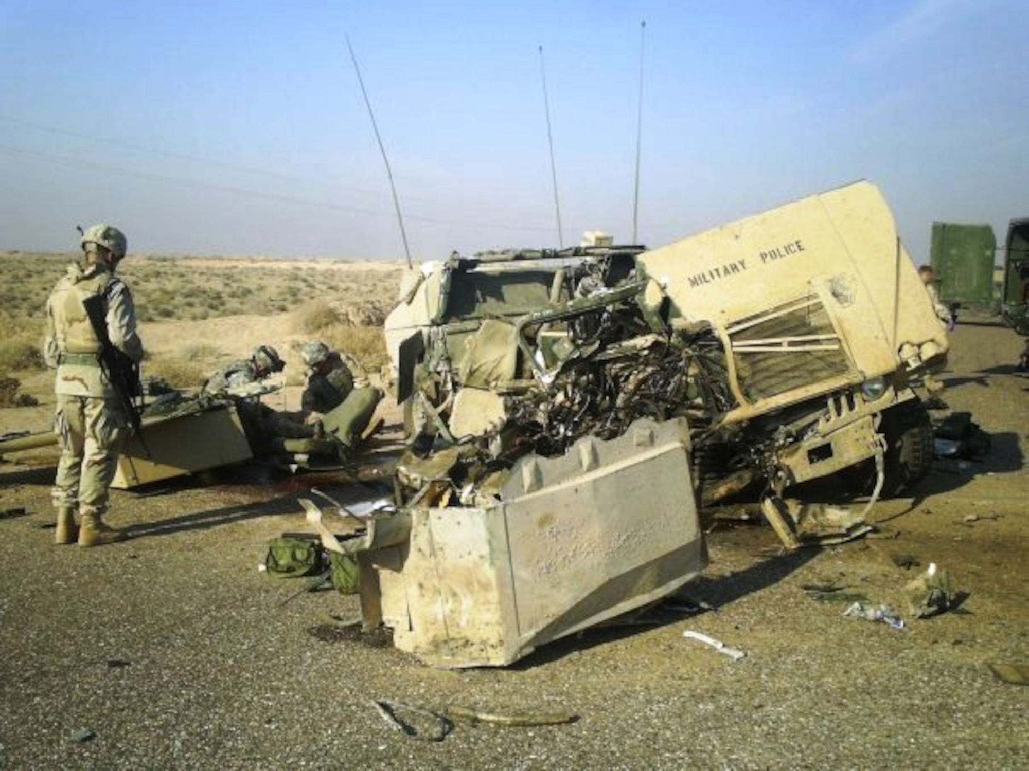 Tech. Sgt. Francis Woznick, 366th Security Forces Squadron, examines the wreckage of one of his unit’s vehicles that was hit with an improvised explosive device in Iraq. Woznick hadn’t returned from war the same man he was when he left, he said, citing: “I was mad, hostile and mean – quick to anger and didn’t like being in closed areas or around a certain type of people without getting on edge. That was, and still is, a battle. It will always be that way, but I have learned valuable lessons, and have an amazing wife who believes in me and helps me when I need it.” (Courtesy photo)