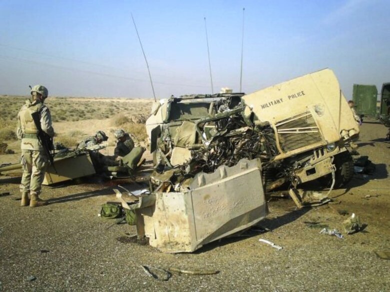 Tech. Sgt. Francis Woznick, 366th Security Forces Squadron, examines the wreckage of one of his unit’s vehicles that was hit with an improvised explosive device in Iraq. Woznick hadn’t returned from war the same man he was when he left, he said, citing: “I was mad, hostile and mean – quick to anger and didn’t like being in closed areas or around a certain type of people without getting on edge. That was, and still is, a battle. It will always be that way, but I have learned valuable lessons, and have an amazing wife who believes in me and helps me when I need it.” (Courtesy photo)