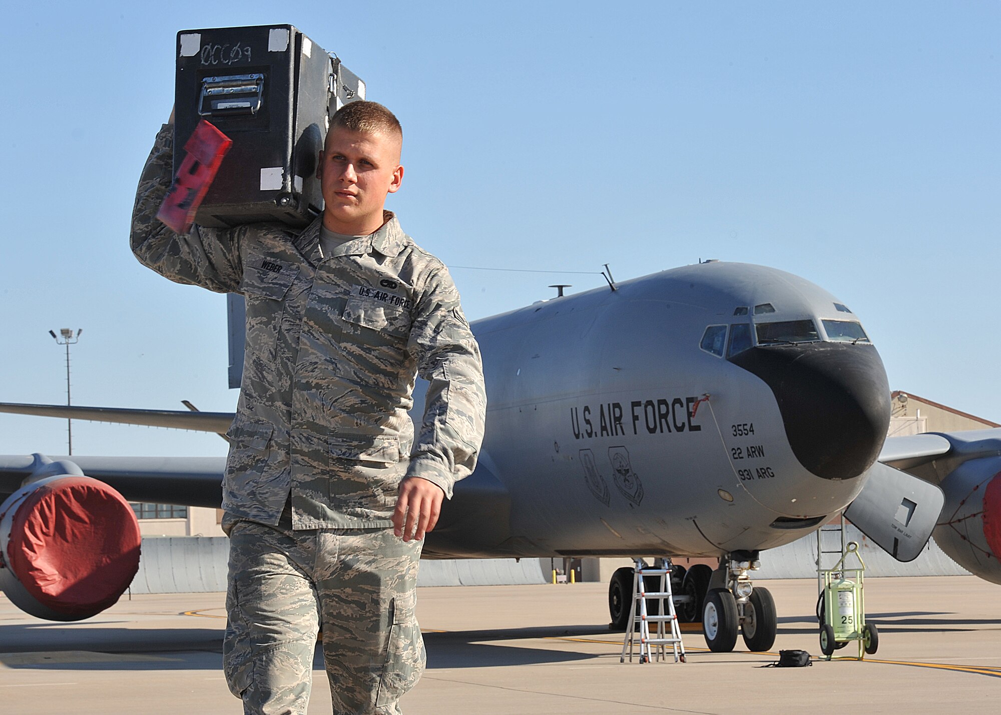 Airman 1st Class Austin Weber, 22nd Aircraft maintenance Squadron aerospace maintenance journeyman, carries a tool box Nov. 16, 2012, McConnell Air Force Base, Kan. Weber was selected as the spotlight performer for the week of Nov. 12 to 16, 2012, for fulfilling the 22nd ARW commander’s intents. (U.S. Air Force photo/Airman 1st Class Maurice A. Hodges)