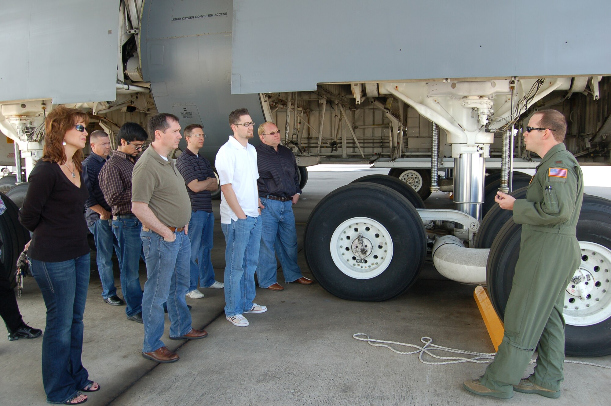 Second Lt. Mike Blakley, a C-5 Galaxy pilot assigned to the 433rd Operations Group's 68th Airlift Squadron, explains the C-5's complex and unique landing-gear mechanism to visitors from USAA's Mortgage Division.  The 68th AS is one of two flying squadrons assigned to the 433 OG at the 433rd Airlift Wing, a C-5 equipped, Air Force Reserve unit located at Joint Base San Antonio-Lackland.  (U.S. Air Force photo by Elsa Martinez)