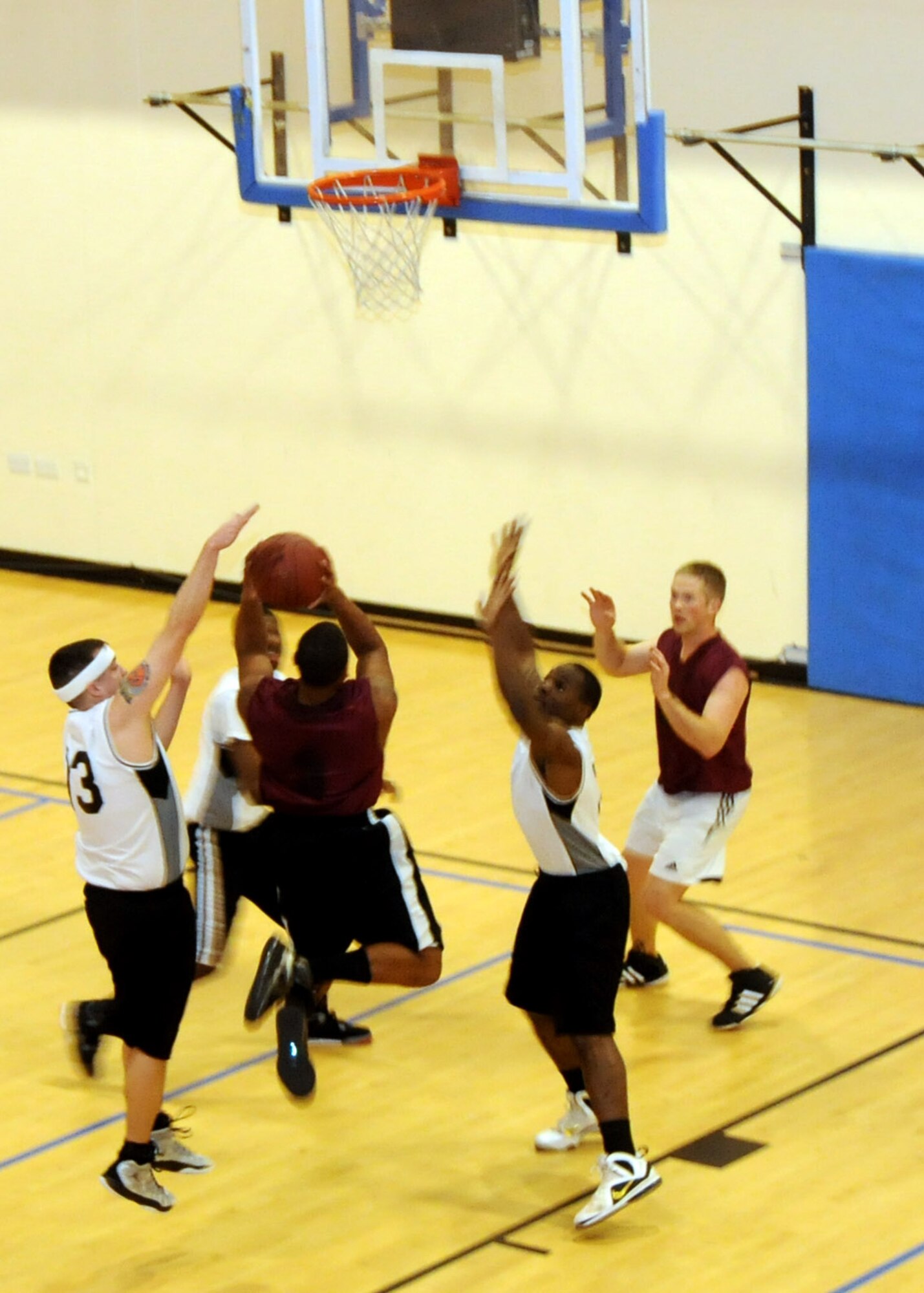 Senior Airman Johnathon Thorpe, 488th Intelligence Squadron cyber transport journeyman from Orlando, Fla., goes for a layup against the 352nd Special Operations Squadron during an intramural basketball game Feb. 7, 2013, at the Hardstand Fitness Center at RAF Mildenhall. The 352nd SOG won the game 54-28. (U.S. Air Force Photo by Airman 1st Class Kelsey Waters/Released)