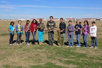 (From left to right) Brittney Pommier, Leah Reed, Nicole Aldover, Kateylyn Derlein, Micah Hunter, Aley Chenaille, Josia Hohhney. Rj Heyburn, Cassandra Davis, Brian Ortiz, Andrew Estrada and not pictured Ethan Fagan, pose for a group photo Feb 1, 2013, at Joint Base San Antonio-Randolph. The students from the Randolph Middle School were selected as part of the regional middle school band. (U.S. Air Force photo by Joshua Rodriguez/ Released)